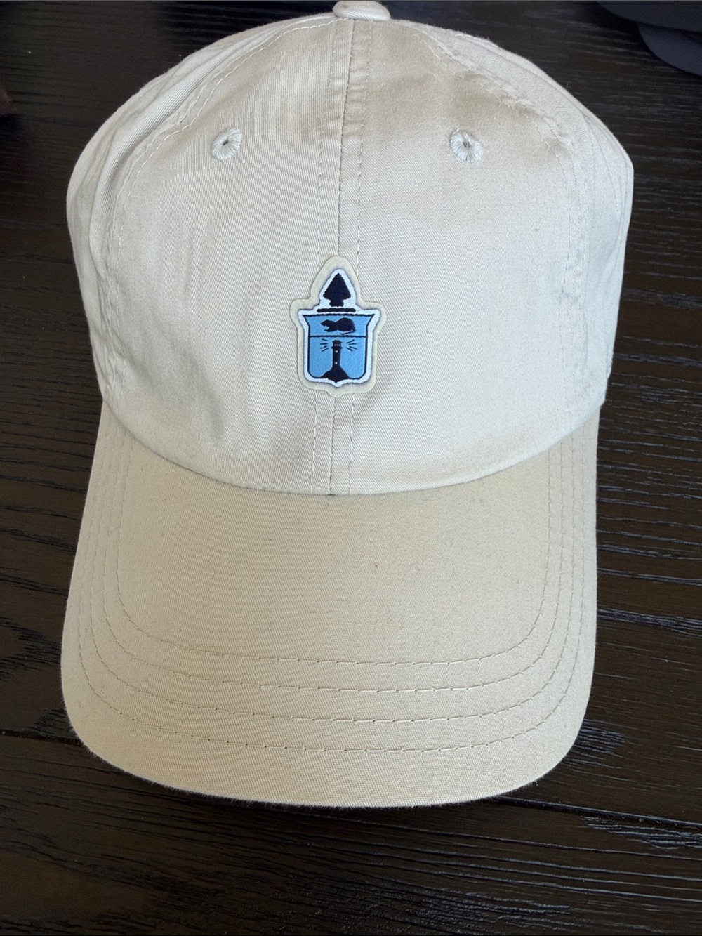American Needle Cream Baseball Cap with Blue Crest Patch